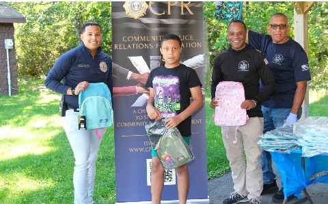 Community partners distribute backpacks
